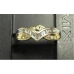 Lady's diamond ring 10k yellow and white gold: diamonds (round and baguette cut, approx .38 carats, 