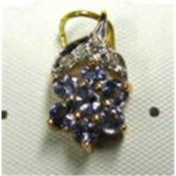 Tanzanite and diamond pendant 14k yellow and white gold: tanzanite (round, faceted, approx. .5 carat