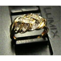 Lady's diamond ring 14k yellow gold: diamonds (round and baguette cut, approx. .25 carats, clarity S