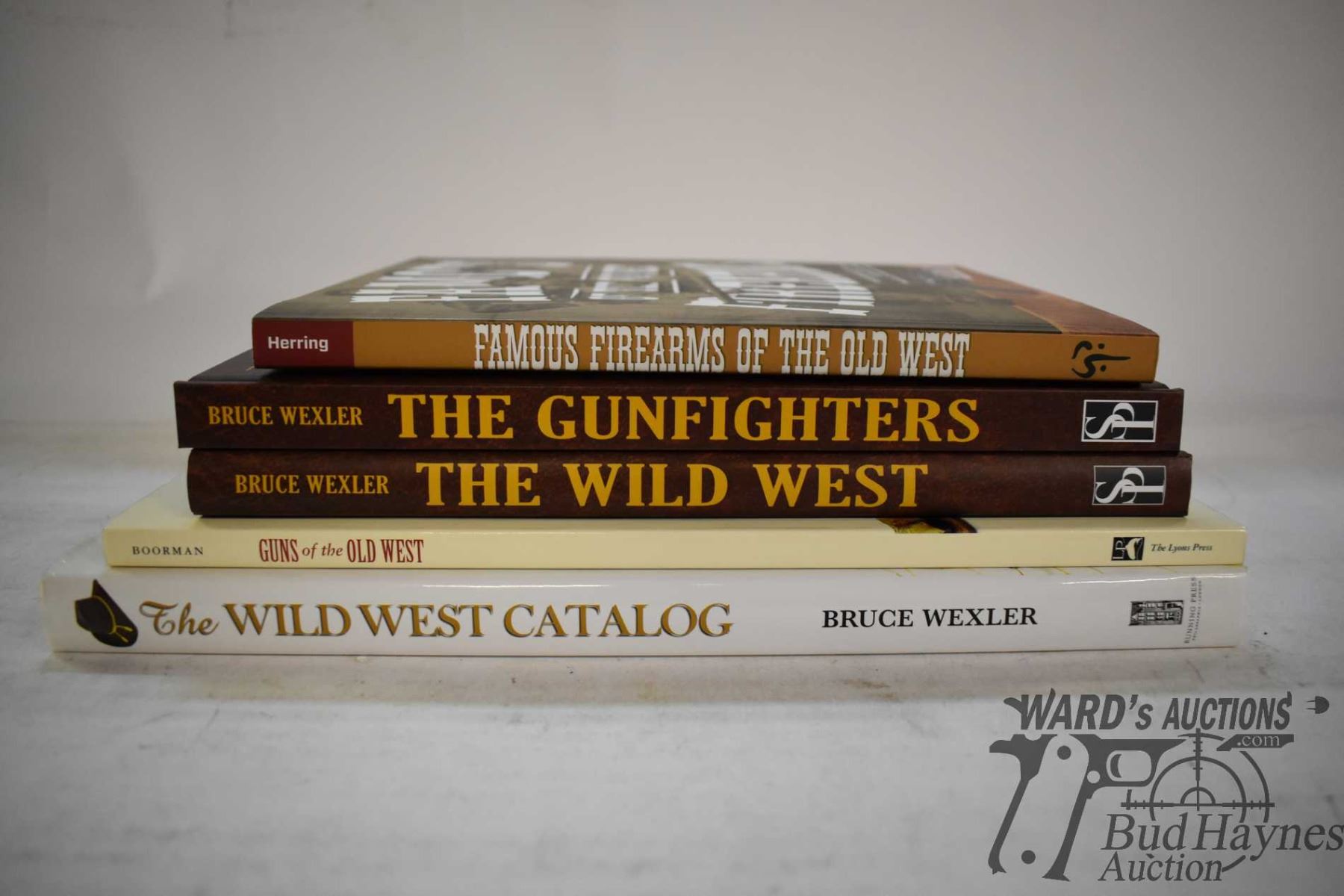 Five books including hardcover "The Wild West Catalog", "The Gun