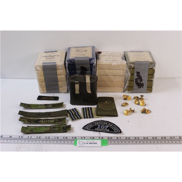 Army Lot: (12) Canadian Buttons, (21) Triangular Bandages, Name Badges, Can of Army Rations