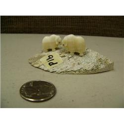 CHOICE on 4 groups of 2 ivory musk ox by Robert Kokuluk mounted on old whale bone (2)