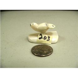 Small ivory flying bird carved form whales tooth and mounted on whales tooth, 1.5" long (3)