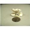 Image 1 : Small ivory flying bird carved form whales tooth and mounted on whales tooth, 1.5" long (3)