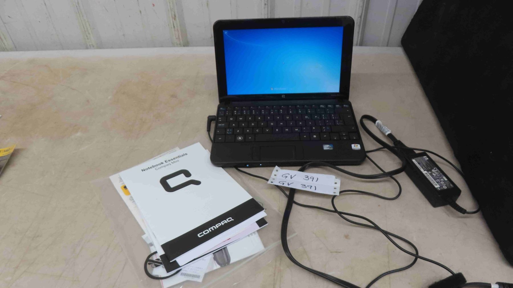 Compaq Mini Laptop with Power Cord and Manual