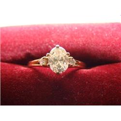 Three stone diamond ring .85 oval solitaire