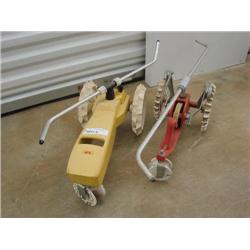 Two lawn watering tractors