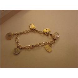 Charm bracelet-most charms are 10K