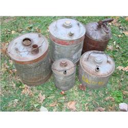 5 old metal oil cans