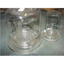 2 glass chicken feeders