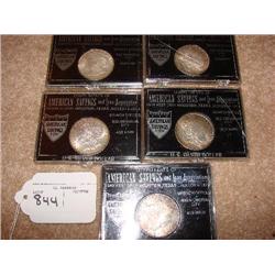 5 Mixed date Morgan dollars in cases