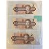 Image 2 : 3 1986 MINT CANADIAN $2 BILLS IN SEQUENCE, LAST YEAR OF THE $2 BILL