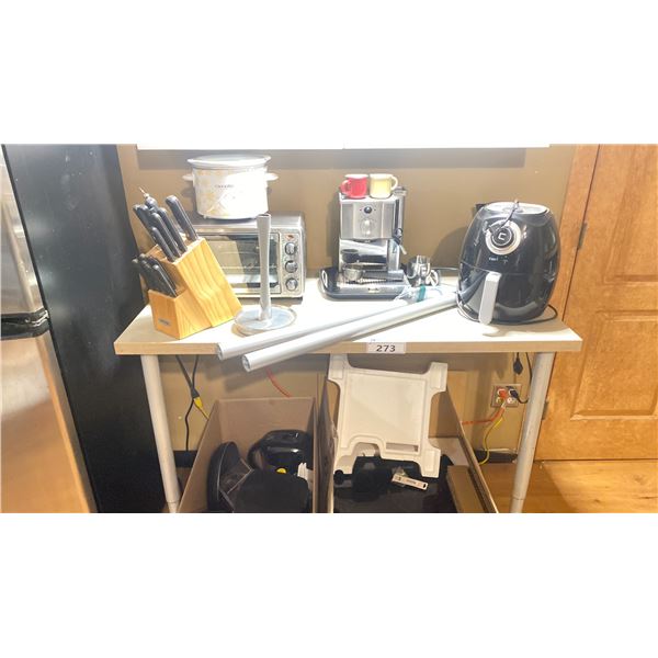 WHITE COUNTER HEIGHT TABLE FILLED WITH SMALL KITCHEN APPLIANCES - WHIRLPOOL INDUCTION COOKTOP,