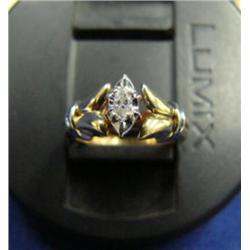 Diamond solitaire lady's ring, 10K yellow and white gold, marquise cut, approx. .07 carats, clarity 