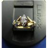 Image 1 : Diamond solitaire lady's ring, 10K yellow and white gold, marquise cut, approx. .07 carats, clarity 