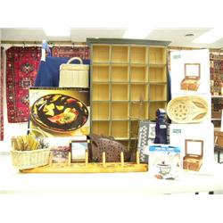 Shelf containing wood display rack, cobalt blue bottle,  brand new electronic symphonian box that pl