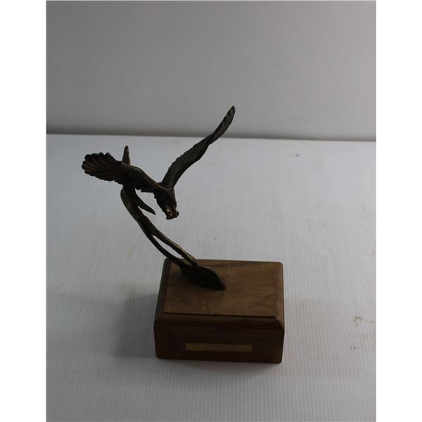 Metal Eagle Sculture on a Wooden Stand