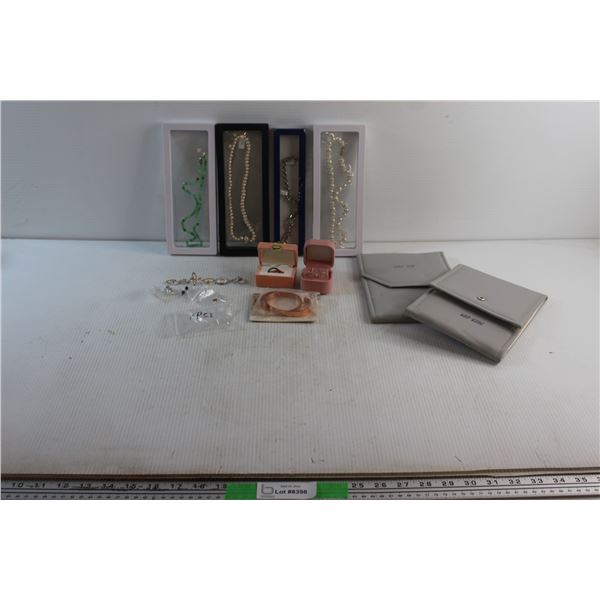 (4) Necklaces, (9) Rings. (2) Pairs of Earrings, Bracelet and (2) Jewelry Display Cases