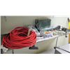 Image 1 : Contents of Shelf: Extension Cords, Surge Protector, Sponges, etc. (shelf not included)