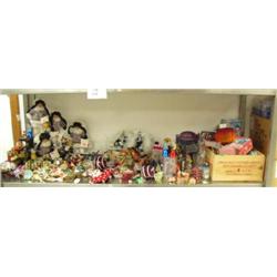 Shelf full of new Christmas tree ornaments, genuine porcelain native dolls, collector's spoons, glas