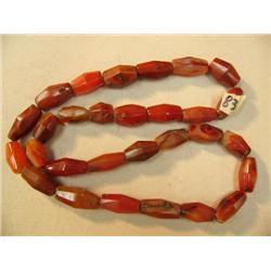 Strand of 28" Faceted Amber beads (3)