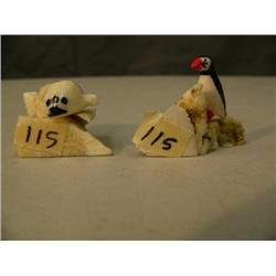 Two carvings: 1.5" puffin rookery with one bird by Seeganna, and an outstanding 1.25" seal with inse