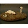 Image 1 : Circa 1960 ivory hunter  (2") with a polar bear (3") mounted on a whale disk (3)