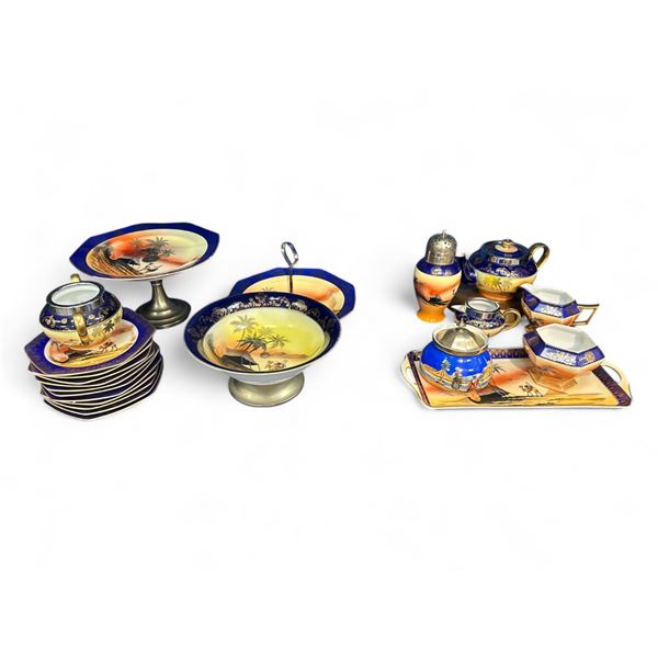 Large Lot Of Hand Painted Desert Scene China Ware, Teapot, Plates, Cream And Sugar, Platter, And Mor