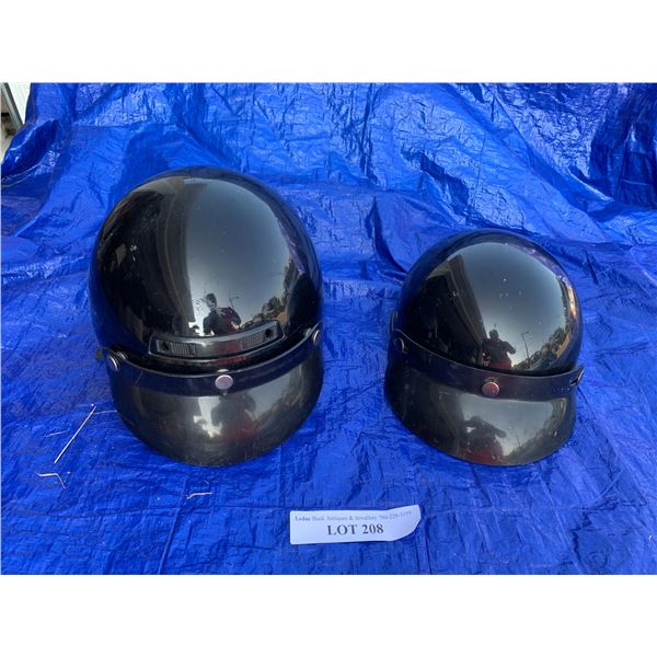Two Black Motorcycle Helmets
