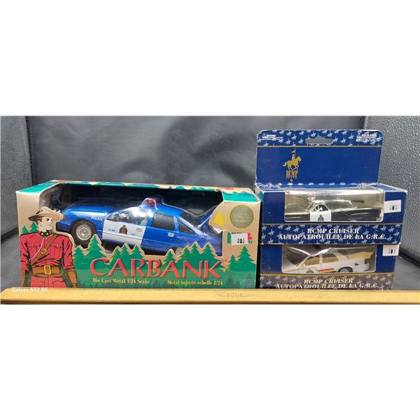 Collection of 3 die cast police cars in boxes