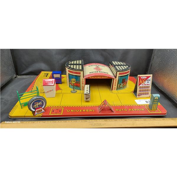 Vintage tin litho garage with gas station accessories