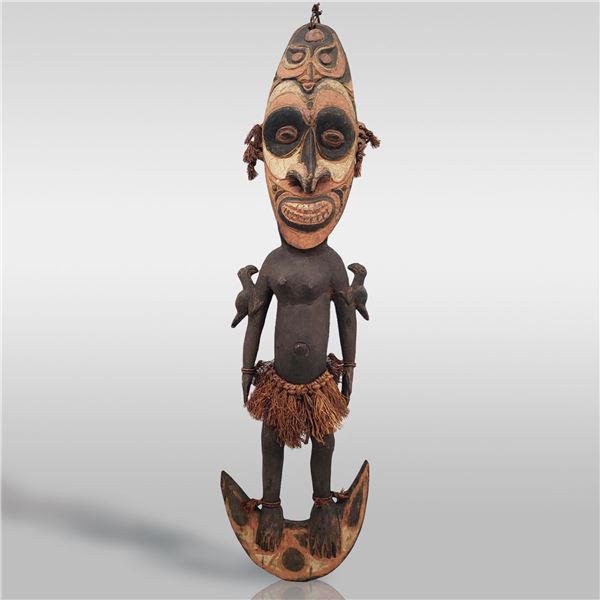 A Large Wood Carved Papua New Guinea Two-Face Spirit Sepik Figure