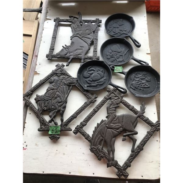 Cast iron western trivets/plaques & 4 cast iron