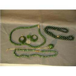 Lot of jade jewelry: apple on gold chain; jade bead necklace, 4"; 20" jade necklace; chunk jade neck