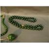 Image 3 : Lot of jade jewelry: apple on gold chain; jade bead necklace, 4"; 20" jade necklace; chunk jade neck