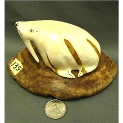 Circa 1950 4" ivory walrus, ivory has some dark brown streaks in it - may have been a crack that was