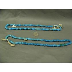 Two strands of old blue trade beads 22" each. (3)