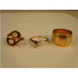 14K Gold ring without stone and 10K gold ring with two pearls and a very heavy gold band, total weig