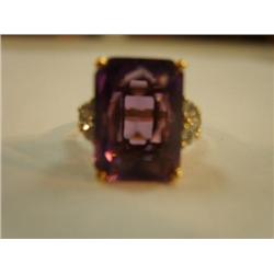 Appx .5 carat amythyst with 6 diamonds that are about  .10 carats each 14k (241)