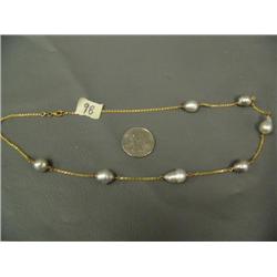 14K gold necklace with 7 large black pearls length is 18"(241)