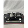 Image 2 : A Lot of 3 Diecast Cars on Stands