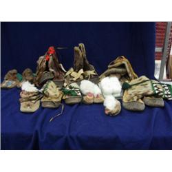 Large lot of Eskimo mukluks and mittens: one pr. Caribou mukluks, pr old beaded slippers, pr child's