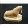 Image 1 : 2.5" fossilized walrus mounted on white ivory base by Aningayou (3)