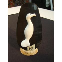 3.25" white ivory combat mounted on a 4.5" baleen plaque with a 2" ivory cormorant head by Byron Kan