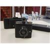 Image 5 : Three antique cameras, collection of masks, asst. silk purses, glass balloon lamp, and asst. items (