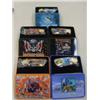Image 18 : Four shelves of Christmas items, comic books, 7 boxes with knifes in them brand new, framed art work