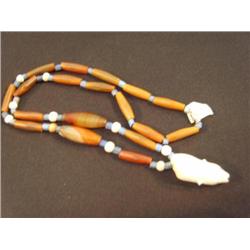 CHOICE ON 2: Carved ivory polar bear pendants mounted on old trade bead necklace (3)