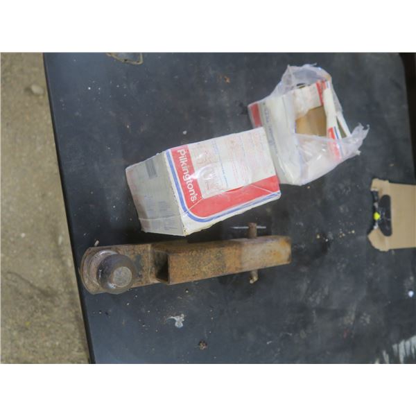 bucket of misc. nails and trailer hitch and tiles