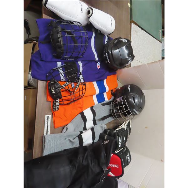hockey helmets , pants , socks , gloves , size m and youth large