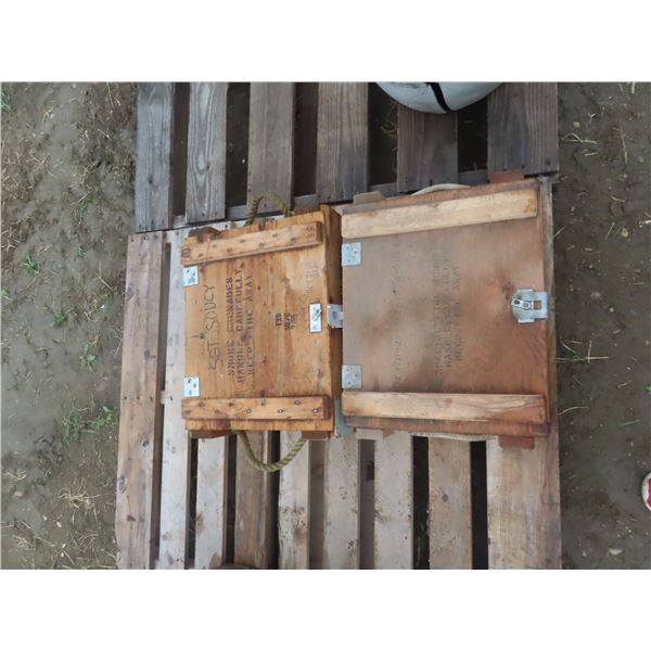 two wooden smoke grenade boxes